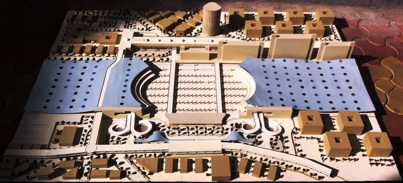 Physical model showing a domed central volume surrounded by perforated plaza and flanking wings