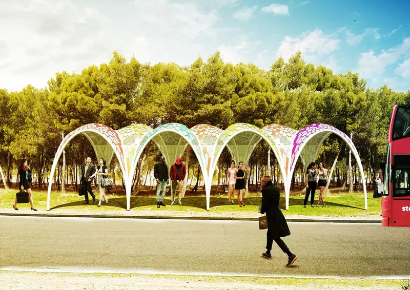 Street view of the arched canopy structure with pedestrians and a bus passing by