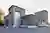 This architectural image showcases a modern industrial building with a corrugated metal facade. The 