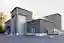 This architectural image showcases a modern industrial building with a corrugated metal facade. The 