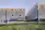 This architectural image showcases a modern industrial building with a striking metal facade and a s