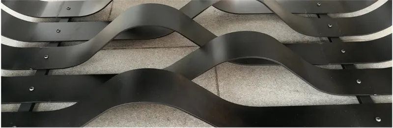 Interwoven metal bands forming dynamic visual layers, emphasizing rhythm, repetition, and material precision.