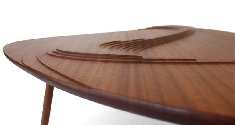 Layered carvings that create depth through light and shadow.