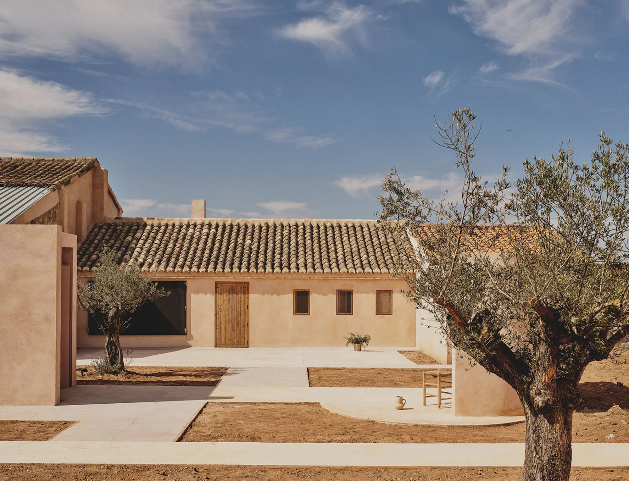 Casu Residence: A Contemporary Home Rooted in a 1930s Winery Renovation in Casas de Eufemia