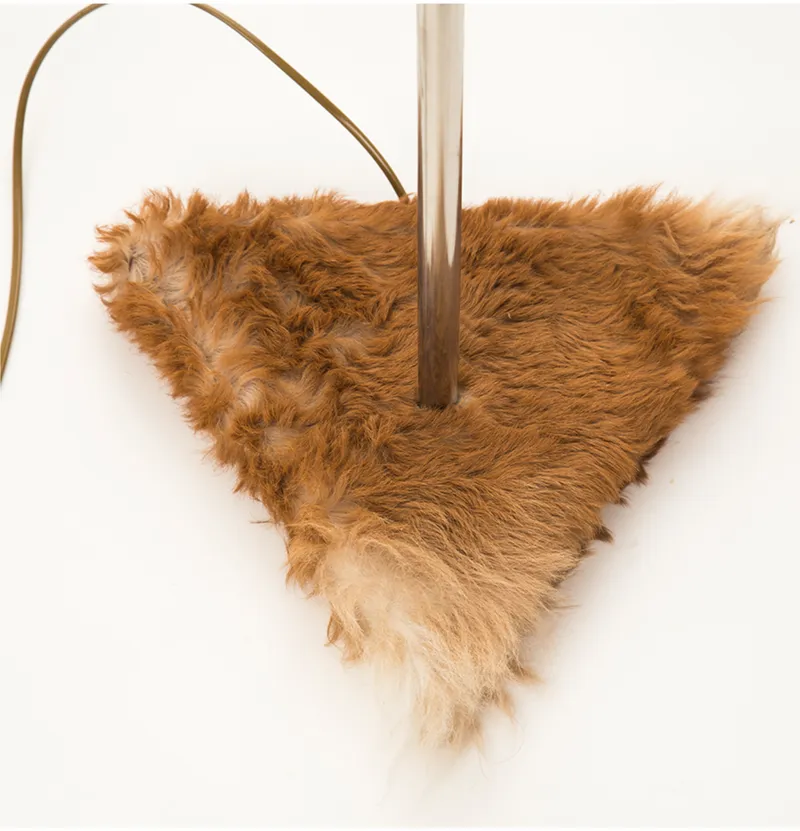 Soft material grounding the industrial structure with warmth and tactility.