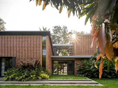 Between the Mango Trees Residence by Enviarch Studio: A Harmonious Blend of Nature and Architecture