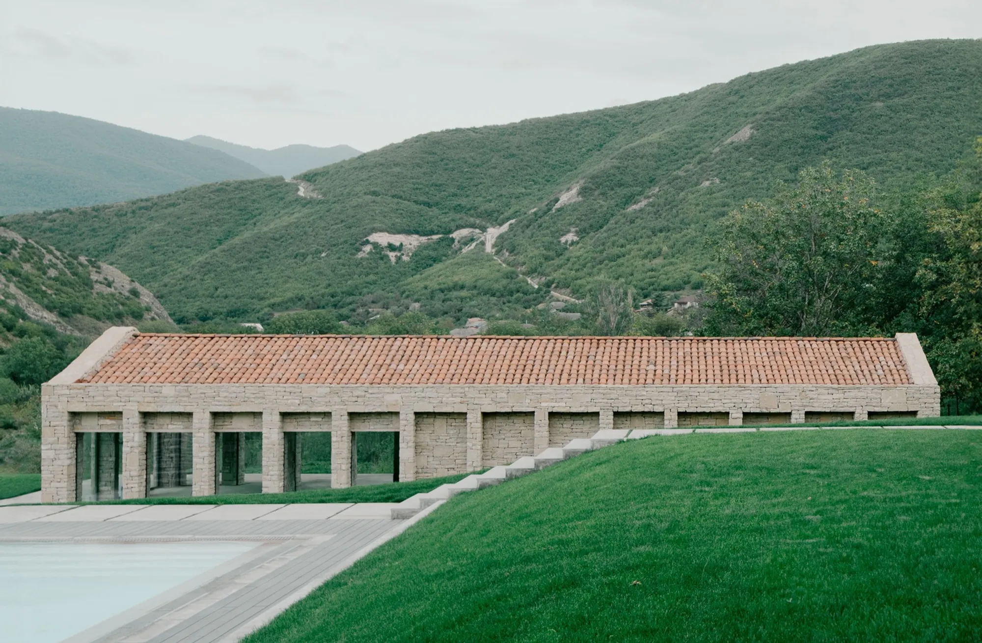 Modern Stone House Design: A Harmony of Tradition and Innovation in Tvaladi