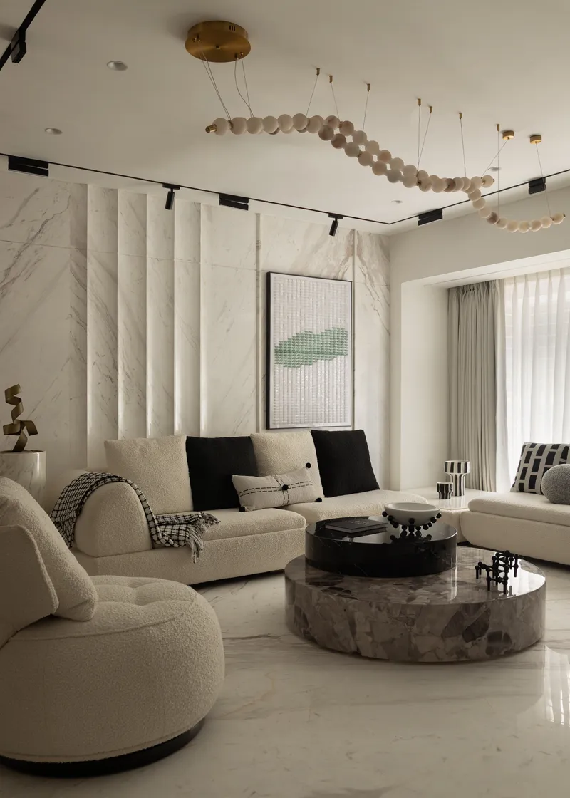 Vertical fluted marble pilasters articulate the feature wall with subtle rhythm and depth.
