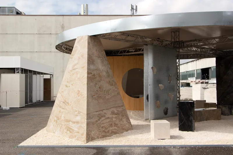 Close-up of the tapered plywood column with circular opening in the timber-clad wall