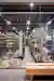 This architectural image showcases the interior of a large warehouse, characterized by its high ceil