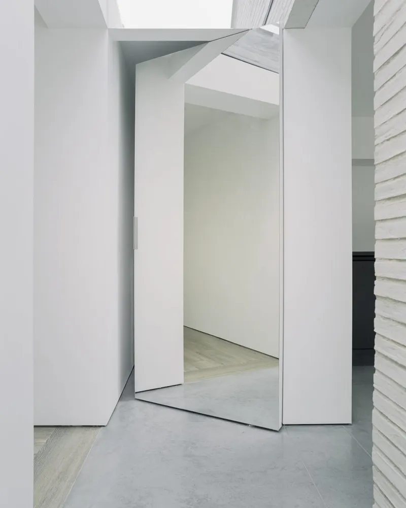 Over the edge pivoting doors