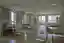 This architectural image showcases a modern hospital room featuring multiple patient beds and baby b