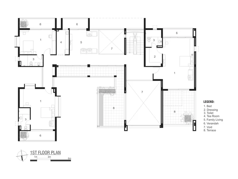 First floor plan showing bedrooms arranged around a central void with family living areas and terraces