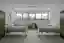 This image depicts a modern hospital room with a minimalist design. The room features two hospital b