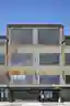 This architectural image showcases the facade of an industrial building, characterized by its corrug